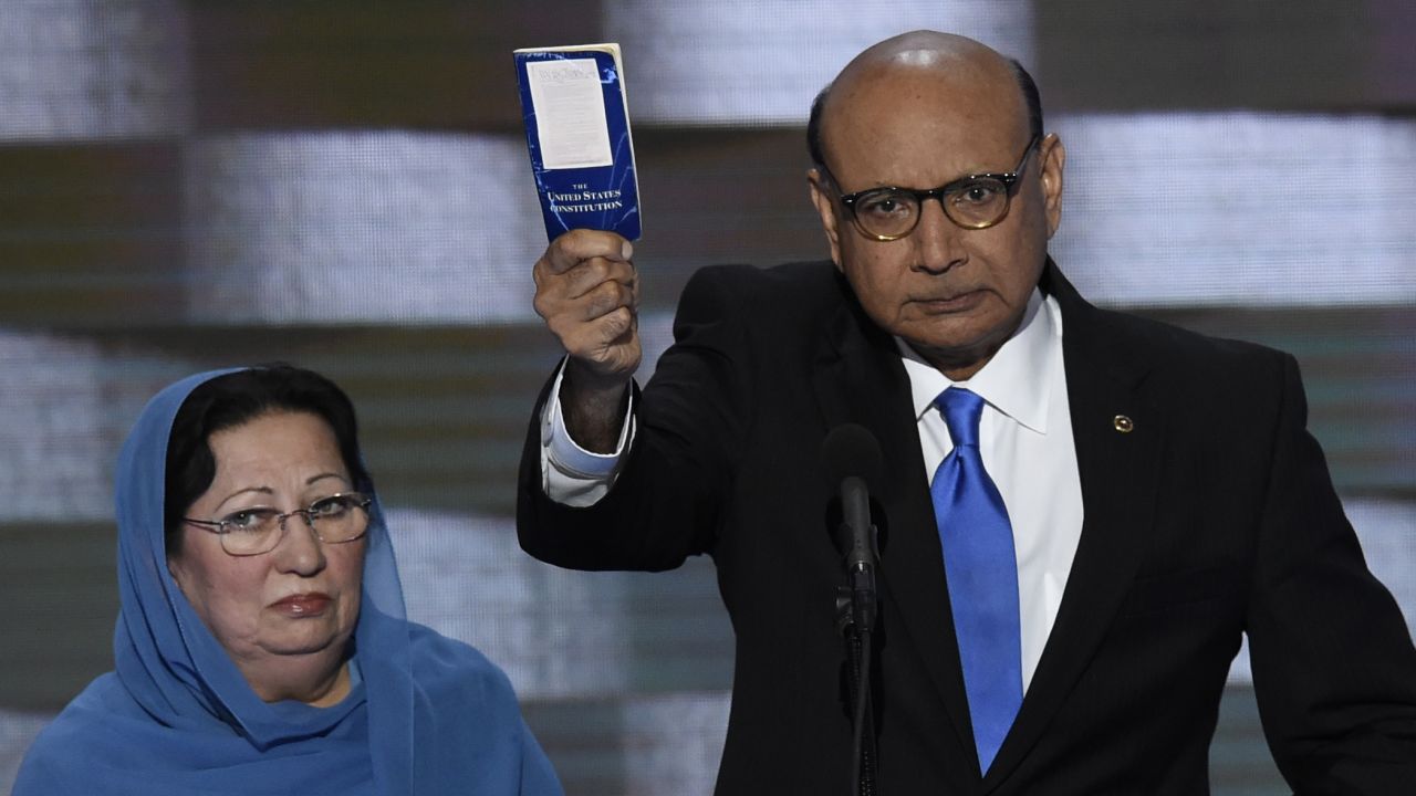 Khizr Khan holds his personal copy of the U.S. Constitution as he speaks Thursday. His son, Humayun S. M. Khan, was one of the 14 American Muslims who have died serving their country since 9/11. In his remarks, Khan criticized the Republican nominee: "If it was up to Donald Trump, (my son) never would have been in America. ... Donald Trump, you are asking Americans to trust you with our future. Let me ask you: Have you even read the U.S. Constitution? I will gladly lend you my copy."