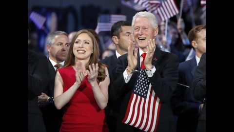 Clinton's husband, former U.S. President Bill Clinton, applauds along with their daughter, Chelsea.