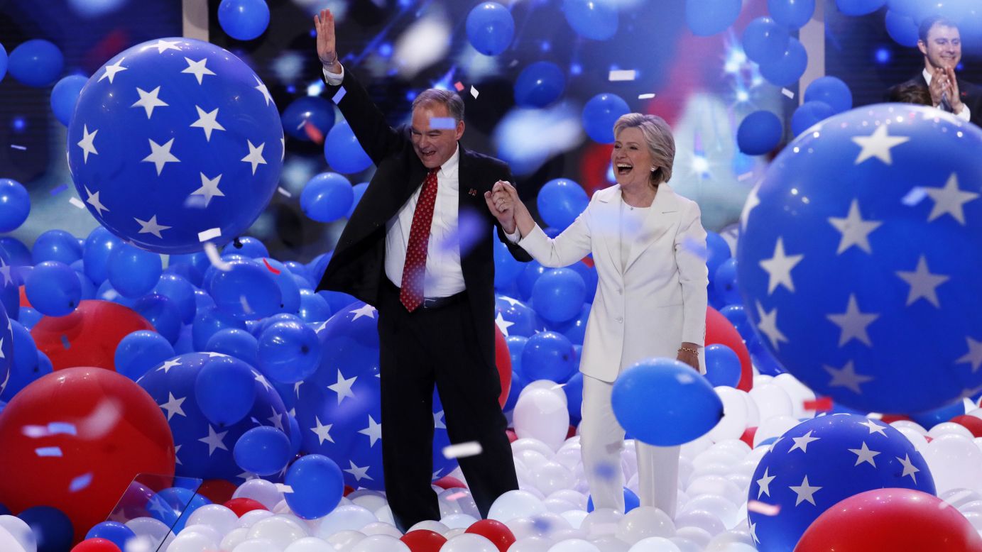Clinton walks on stage with her running mate, U.S. Sen. Tim Kaine.