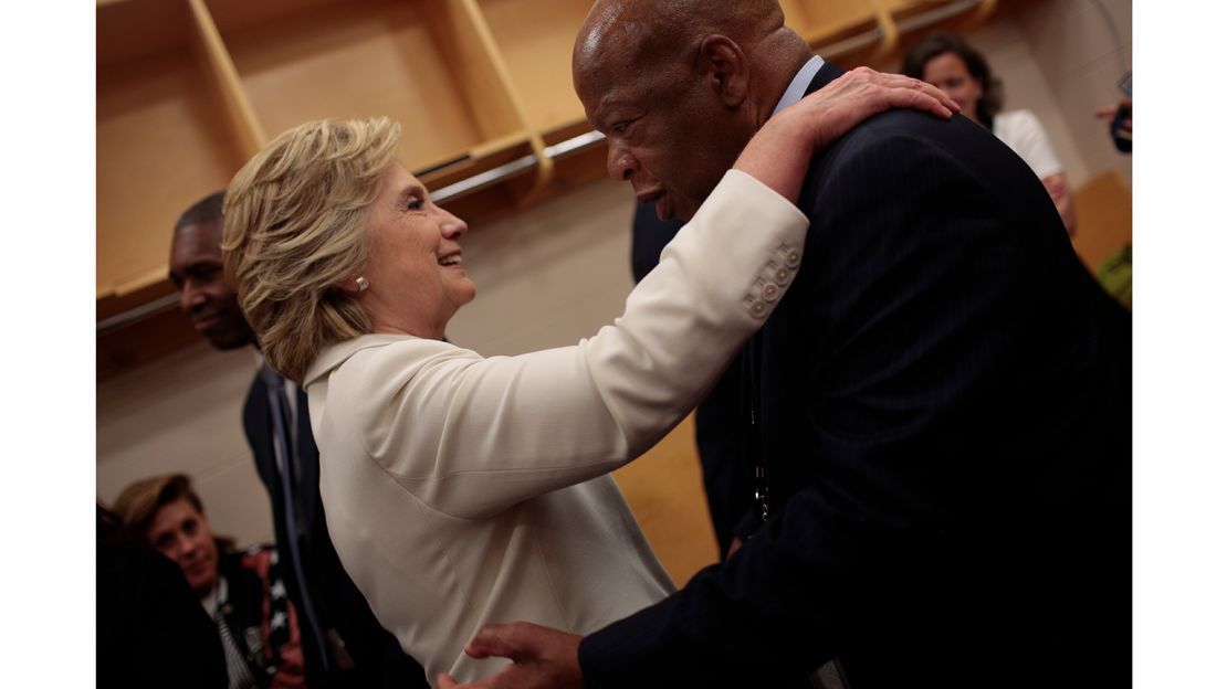 Clinton hugs civil rights leader and U.S. Rep. John Lewis.