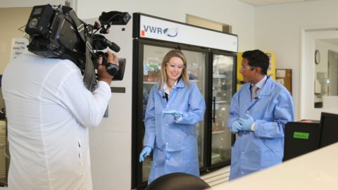 Holmes gives Dr. Gupta a rare tour of a Theranos lab based in Palo Alto, California.