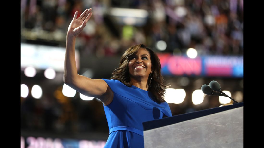 First lady Michelle Obama acknowledges the crowd at the Democratic National Convention on Monday, July 25. "This election -- every election -- is about who will have the power to shape our children for the next four or eight years of our lives," she said. "And I am here tonight because in this election, there is only one person who I trust with that responsibility -- only one person who I believe is truly qualified to be President of the United States. And that is our friend, Hillary Clinton."