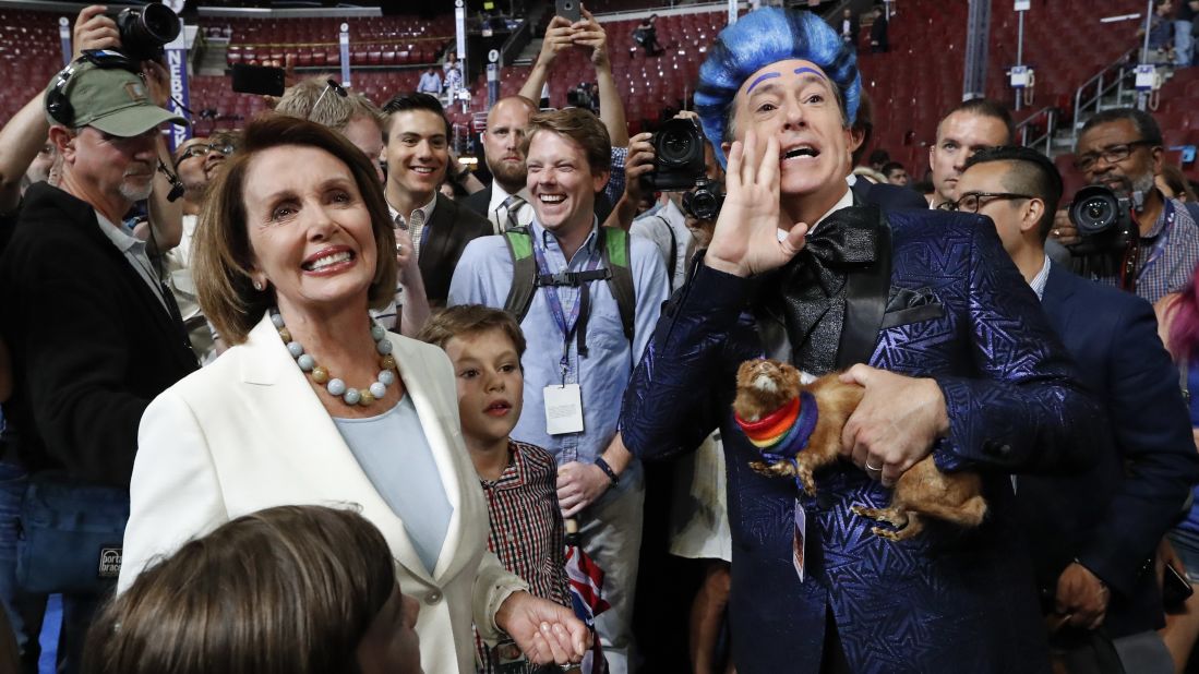 House Minority Leader Nancy Pelosi meets with talk show host Stephen Colbert as he records a segment Sunday, July 24, at the site of the Democratic National Convention.