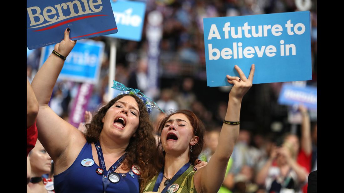 Supporters of U.S. Sen. Bernie Sanders cheer as he speaks at the Democratic National Convention on Monday, July 25. Sanders urged his supporters to vote for Hillary Clinton in November.