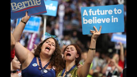Supporters of Sen. Bernie Sanders (I-VT) stand and cheer as he delivers remarks on the first day of the Democratic National Convention at the Wells Fargo Center, July 25, 2016 in Philadelphia, Pennsylvania. An estimated 50,000 people are expected in Philadelphia, including hundreds of protesters and members of the media. The four-day Democratic National Convention kicked off July 25.  
