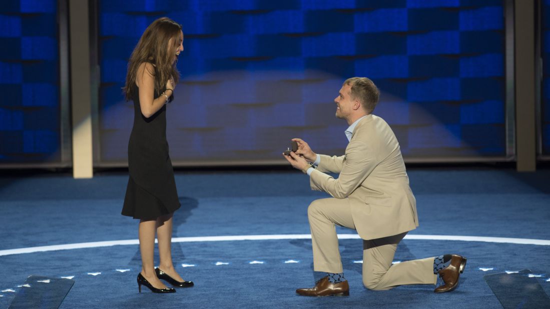 Andrew Binns proposes on stage to Liz Hart, a fellow staff member at the Democratic National Convention on Sunday, July 24.