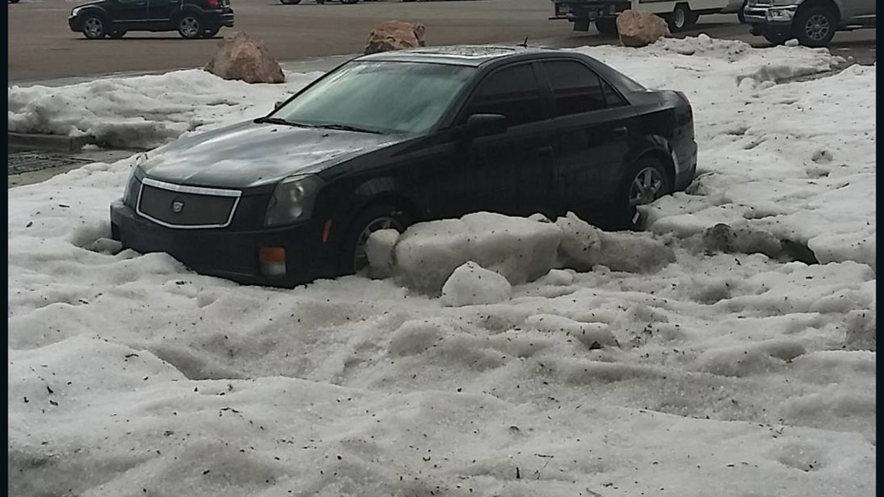 A large mound of ice is blocking a car ten hours after a strong hail storm hit Colorado Springs.