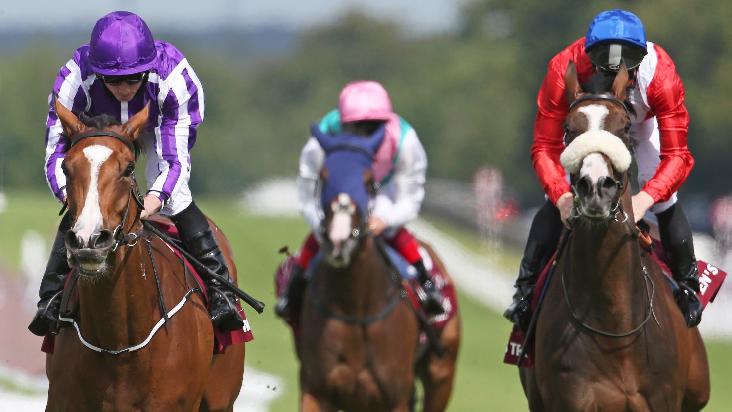Ryan Moore rides Minding (L) to victory at the Nassau Stakes at Goodwood.