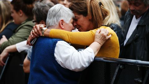 At a memorial ceremony for Rev. Jacques Hamel, woman hugs Sister Daniele Delafosse, a nun who taken hostage during the attack.
