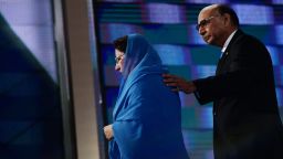 Khizr Khan (R), accompanied by his wife Ghazala Khan (L), walks off stage after speaking about their son US Army Captain Humayun Khan who was killed by a suicide bomber in Iraq 12 years ago, on the final night of the Democratic National Convention at the Wells Fargo Center, July 28, 2016 in Philadelphia, Pennsylvania.