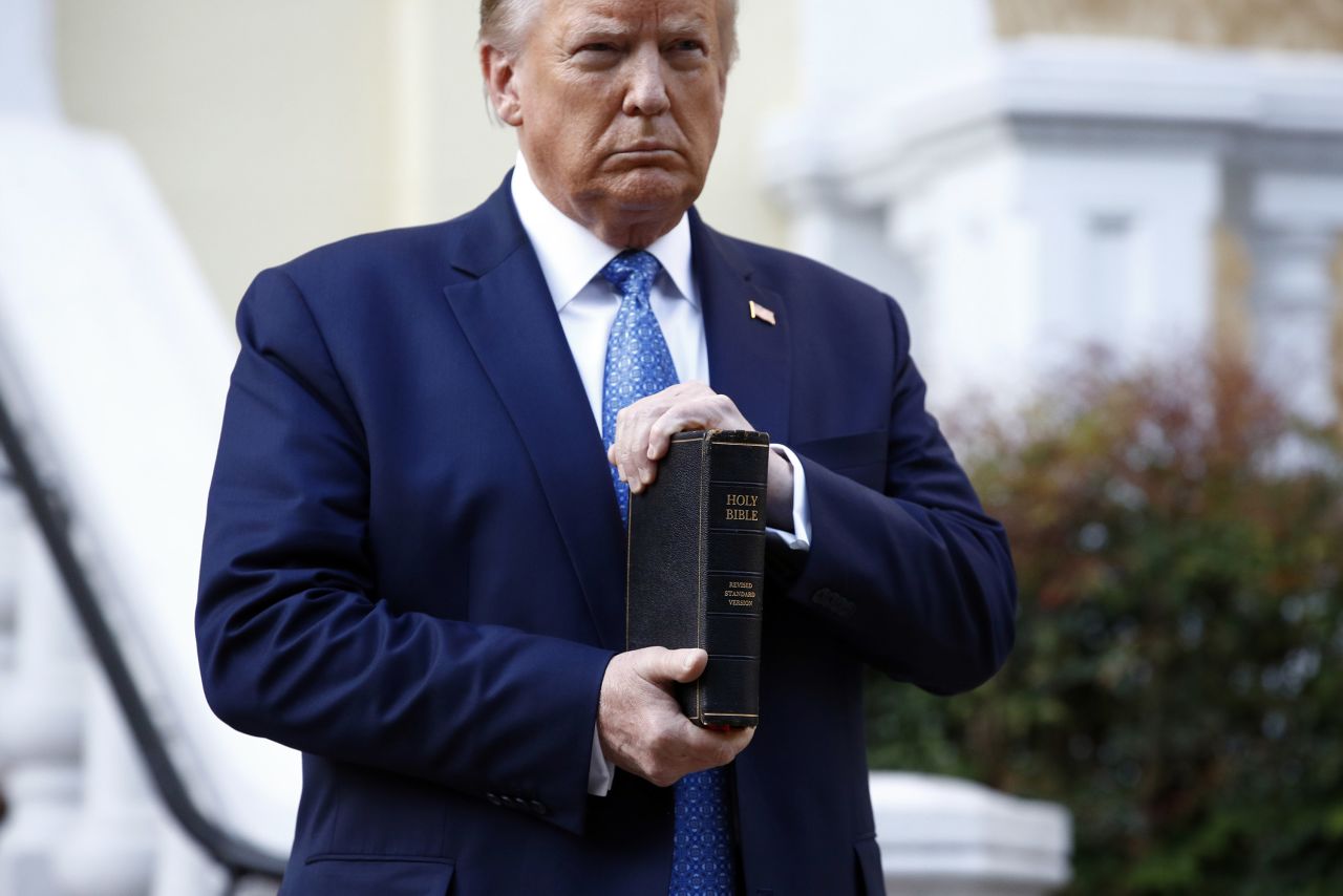 President Donald Trump holds a Bible as he visits outside St. John's Church across Lafayette Park from the White House Monday, June 1, 2020, in Washington.?