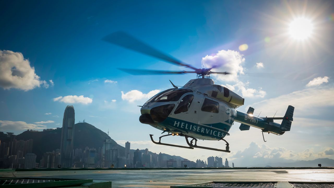 Heliservices' chopper takes off from The Peninsula Hong Kong, the oldest luxury hotel in town. 
