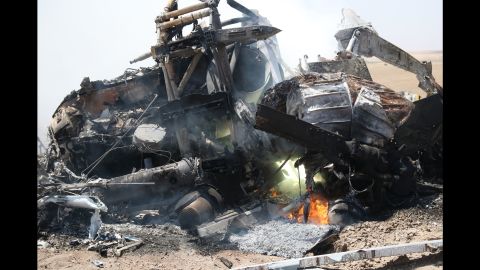 Wreckage of the Russian helicopter is seen Monday after it went down in Idlib province.