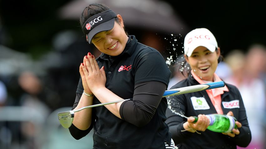 WOBURN, ENGLAND - JULY 31:  Ariya Jutanugarn of Thailand celebrates victory after holing the winning putt on the 18th green during the final round of the Ricoh Women's British Open at Woburn Golf Club on July 31, 2016 in Woburn, England.  (Photo by Tony Marshall/Getty Images)