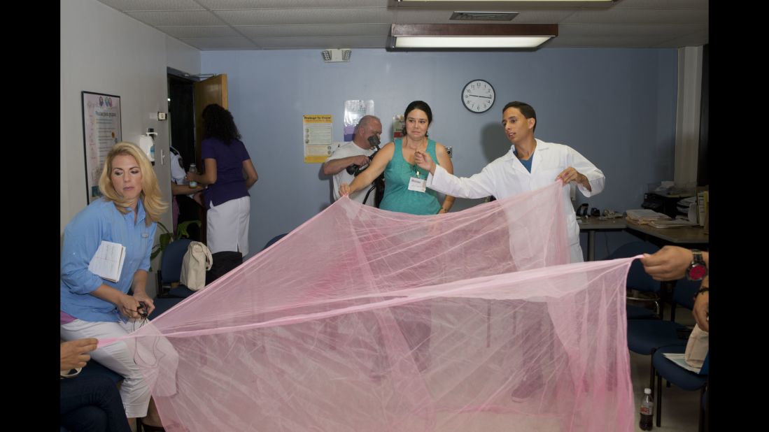 A mosquito net is unfurled during a Zika prevention session at a San Juan hospital.