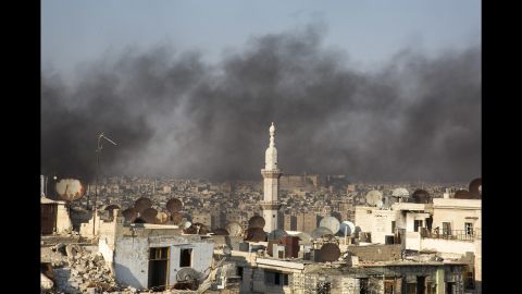A thick smogs hangs over Aleppo as residents light fires to prevent pilots from bombing their homes.