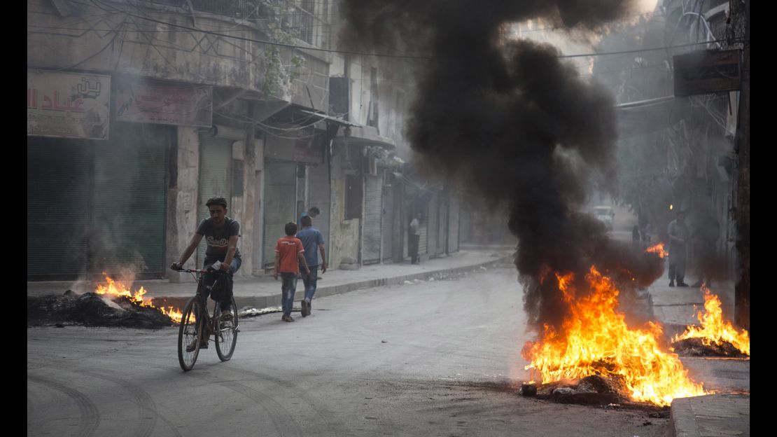 Residents burned tires and other materials to start fires in eastern Aleppo, to obscure the vision of pilots looking to drop bombs on neighborhoods.