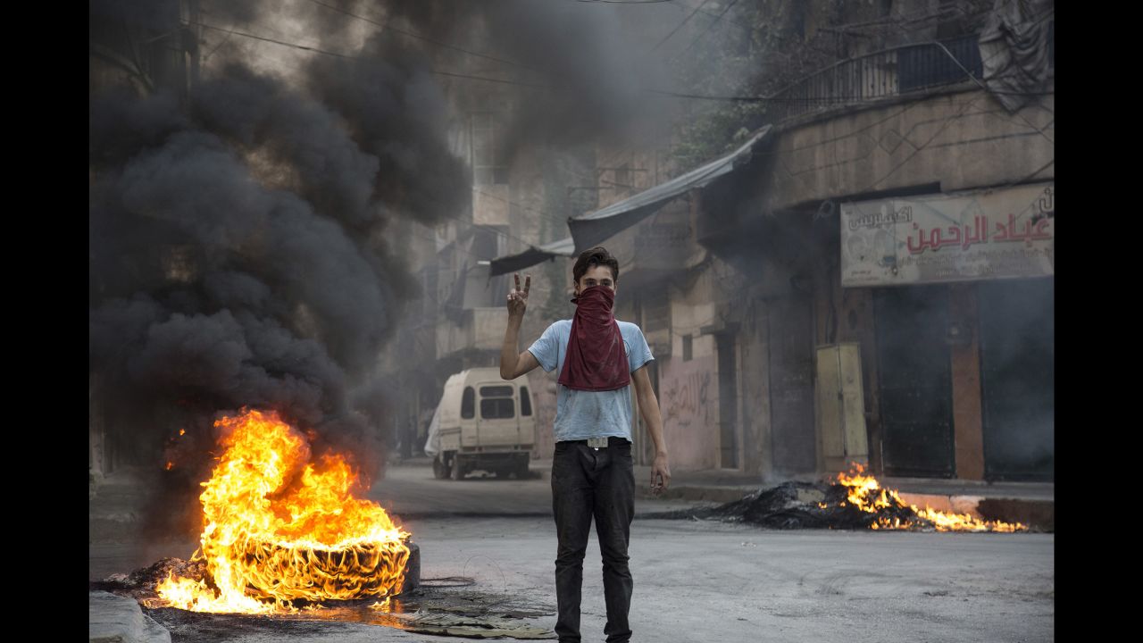 Residents start fires for a second day in the Syrian city of Aleppo on August 1, in hopes the smoke would obscure the vision of pilots bombing from overhead.