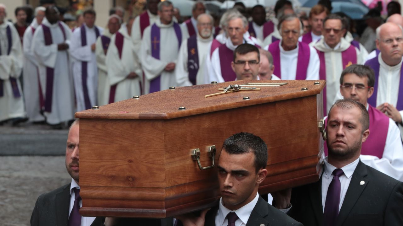 Pallbearers carry the coffin of the priest Jacques Hamel as they enter in Rouen's cathedral on August 2, 2016 during the funeral of the priest who was killed in a church in Saint-Etienne-du-Rouvray on July 26 during a hostage-taking claimed by Islamic State group.