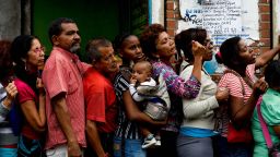 People queue up to buy food and basic household items in a supermarket at the Petare neighborhood in Caracas on July 16, 2016.
The Venezuelan military began overseeing food distribution at ports, airports and businesses Tuesday as part of a plan by President Nicolas Maduro to alleviate acute shortages plaguing the country. / AFP PHOTO / FEDERICO PARRAFEDERICO PARRA/AFP/Getty Images