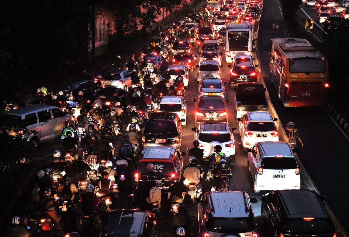 Motorists in a traffic jam on a main road in Jakarta on June 21, 2016.