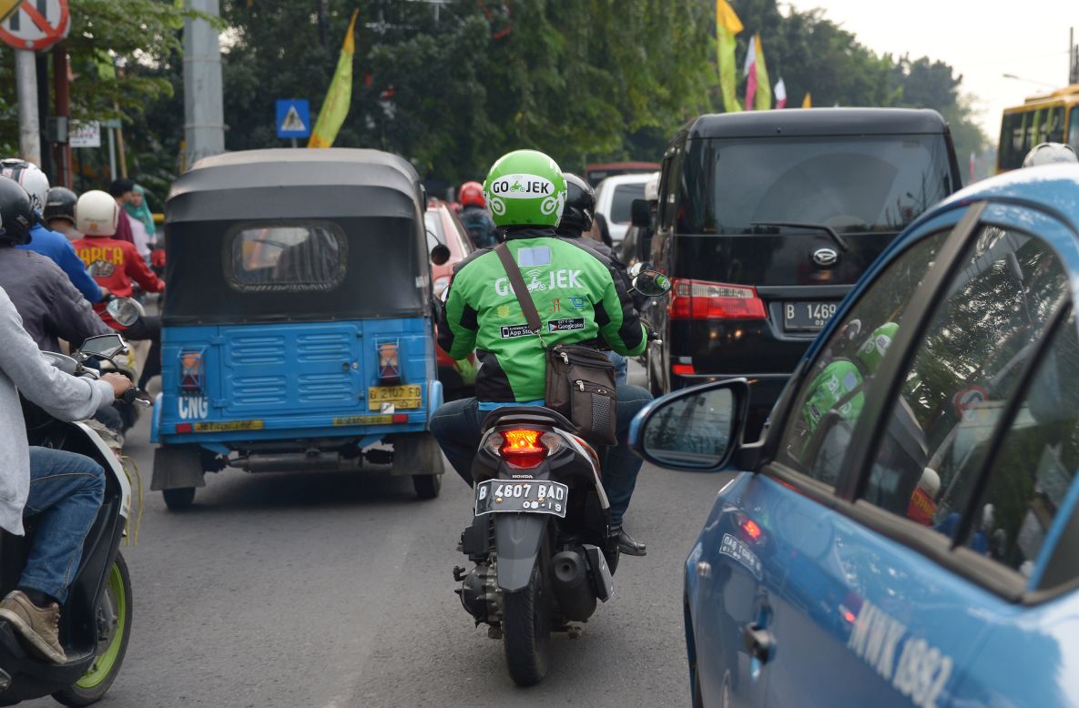 Go-Jek, a popular motorbike-hailing app, is putting a new spin on smartphone taxi services in the Indonesian capital. Thousands of motorcyclists in distinctive green jackets and helmets offer commuters an escape from Jakarta's notorious traffic gridlock.  