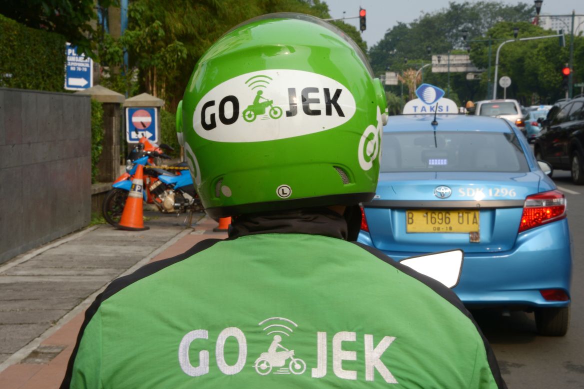 Go-Jek drivers are easy to spot in their bright green uniforms.