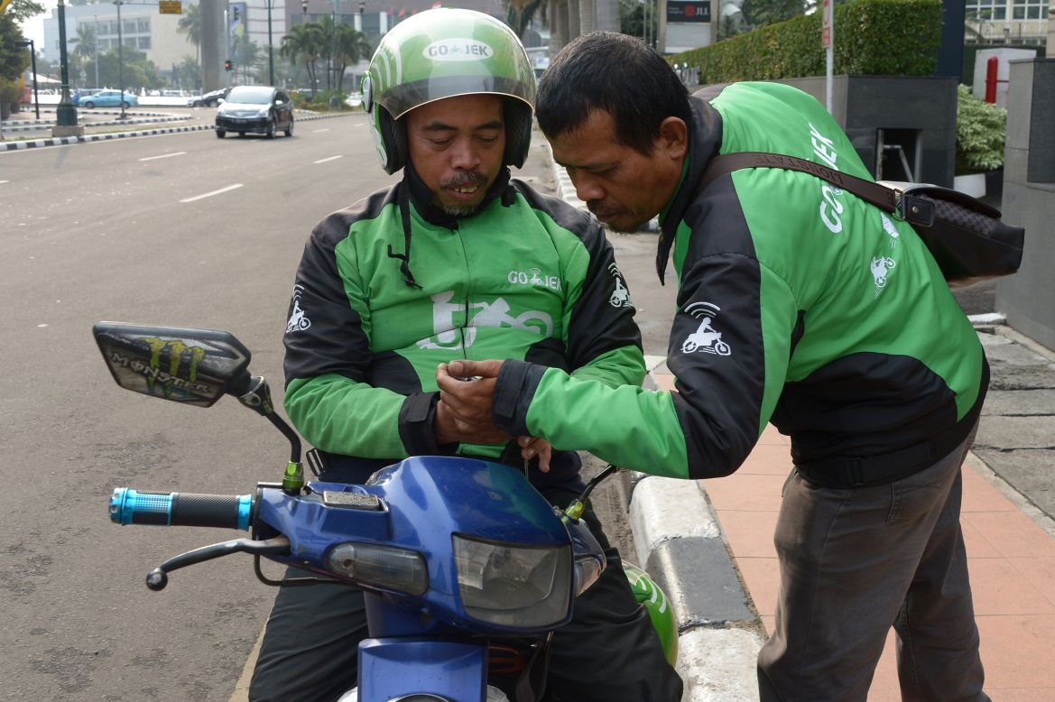Drivers log onto the Go-Jek app, which has seen 25 million downloads since its launch in 2015.