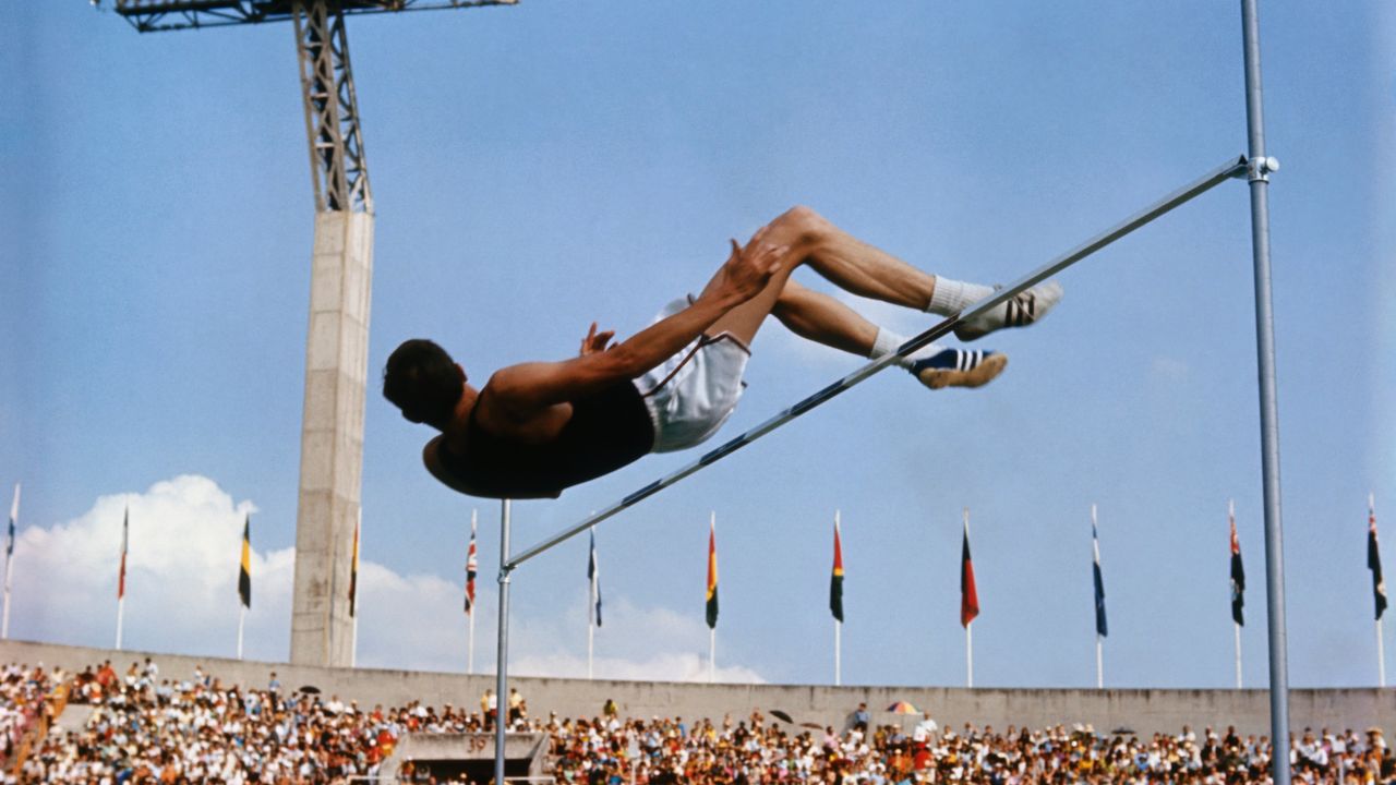 <strong>The Fosbury Flop: </strong>American high jumper Dick Fosbury clears the bar on the way to winning gold at the 1968 Summer Games in Mexico City. His "back-first" jumping style revolutionized the sport and is now used by almost everyone who competes in the event.