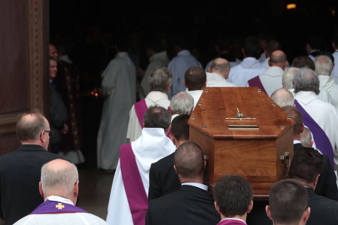 Pallbearers carry the coffin of the Rev. Jacques Hamel into Rouen's cathedral Tuesday.