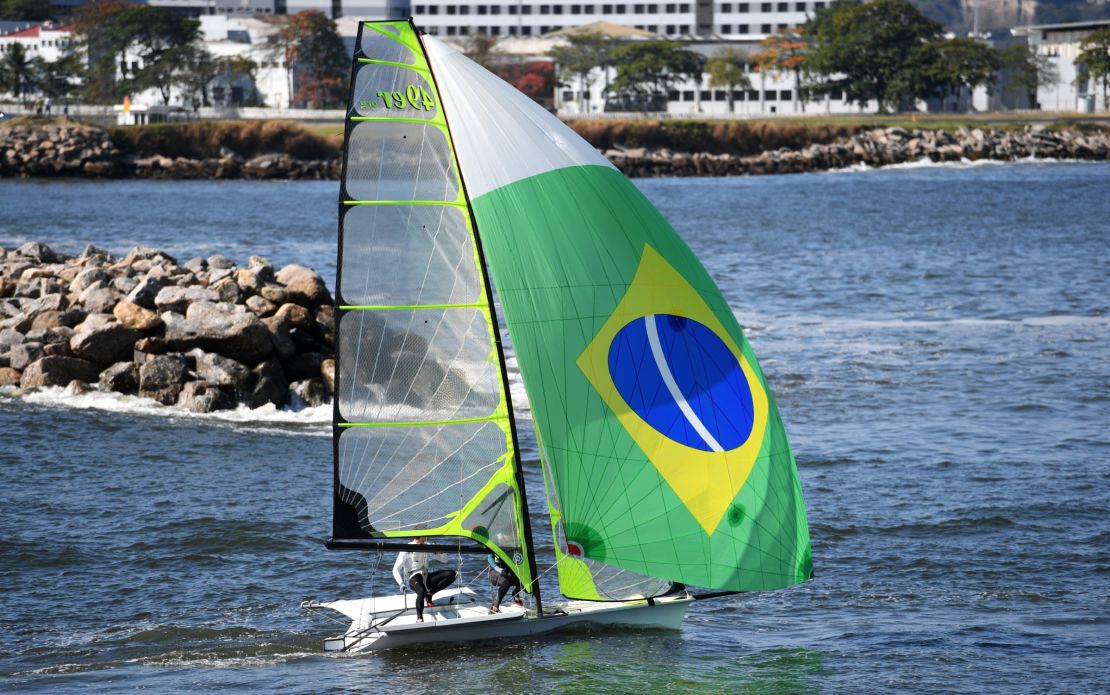 A crew from Brazil heads out through the breakwater to a training session.