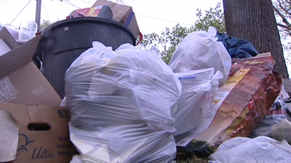 Garbage piles up after Flint fails to reach a long-term trash agreement.