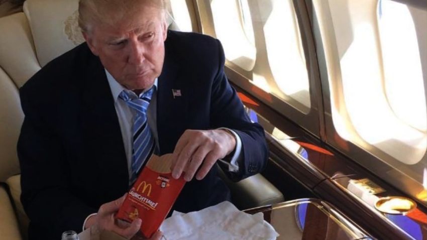 Trump takes a licking for eating finger lickin' chicken with a fork. CNN's Jeanne Moos reports.      KFC Knife and Fork   How do you eat your KFC chicken? Well we now know Donald Trump eats his with a knife and fork. At least there's a knife and fork in the photo the Donald tweeted of himself getting ready to chow down on his private plane with a bucket of KFC next to him and a piece on his plate. Will combine this with Jon Stewart's rant when Trump ate pizza with a knife and fork. And we'll toss in characters on Seinfeld eating Snickers bars with cutlery. We recreated the Trump KFC tableau using our own bucket of KFC. Also did MOS asking folks how they eat their KFC, hands or knife and fork. The hands have it hands down.