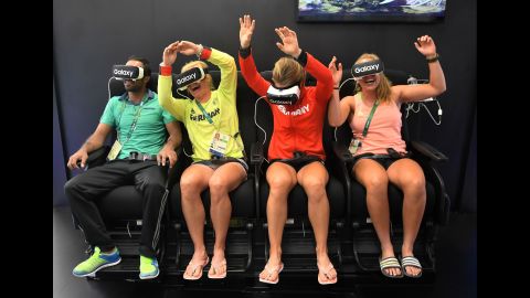 Members of the German Olympic team try out virtual-reality headsets on August 1.