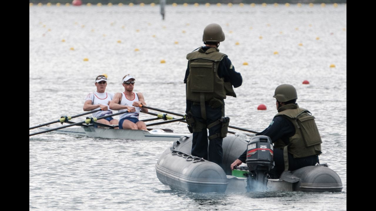 Brazilian Marines patrol the water as rowing teams practice in Rio on Friday, July 29.