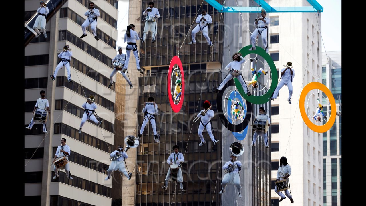Musicians perform in Sao Paulo during the Olympic torch relay on Sunday, July 24.
