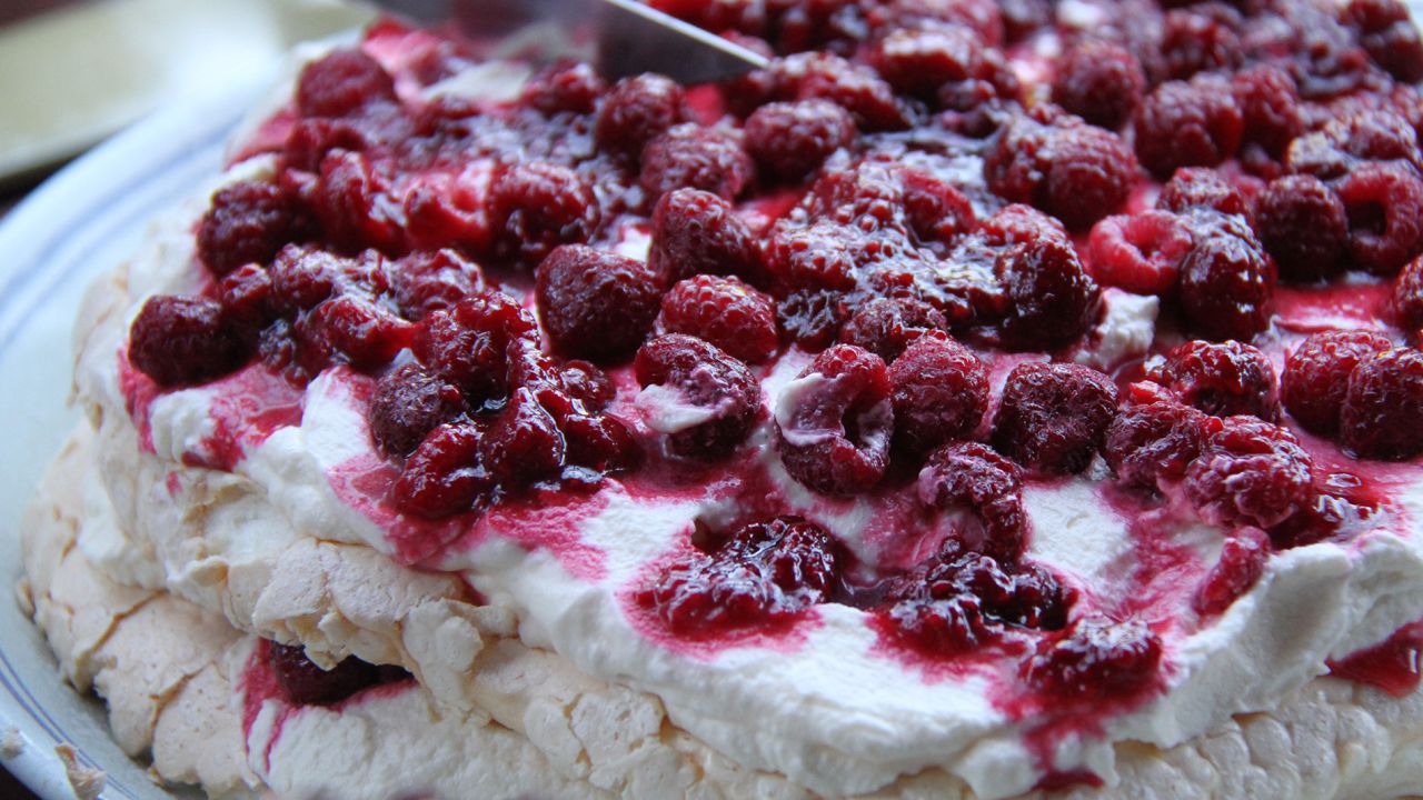 Invented (according to the Oxford English Dictionary) in New Zealand and named after Russian ballerina Anna Pavlova, this meringue treat is served overflowing with whipped cream and summer fruits. Click through the gallery to see other cakes celebrated as national treasures.