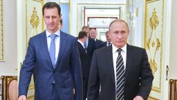 Russian President Vladimir Putin (R) greets his Syrian counterpart Bashar al-Assad upon his arrival for a meeting at the Kremlin in Moscow on October 20, 2015. Assad, on his first foreign visit since Syria's war broke out, told his main backer and counterpart Putin in Moscow that Russia's campaign in Syria has helped contain "terrorism".  / AFP / RIA NOVOSTI / ALEXEY DRUZHININ        (Photo credit should read ALEXEY DRUZHININ/AFP/Getty Images)