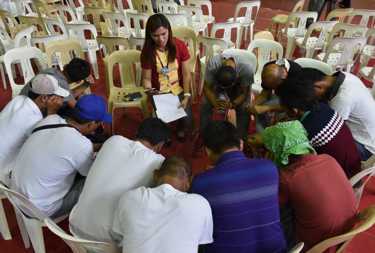 A social worker gives counseling to those who have turned themselves in for drug-related crimes in the Philippines on July 18, 2016.