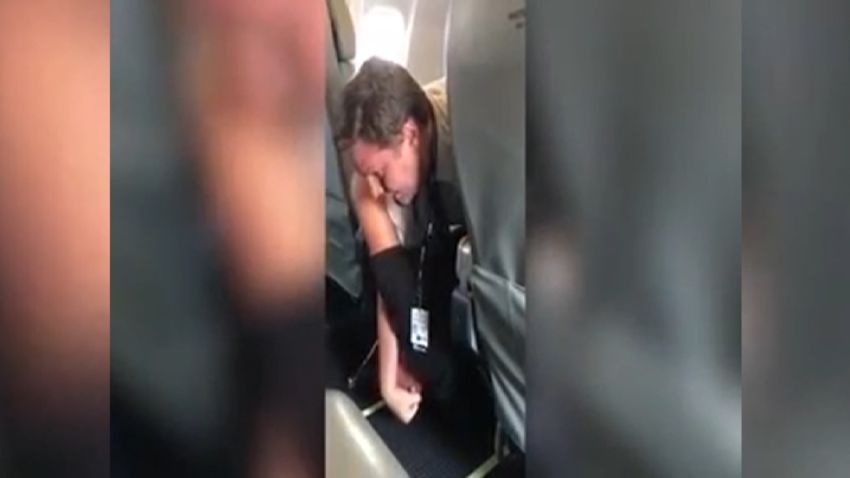 Pilot Tackles Unruly Passenger   CNN Video