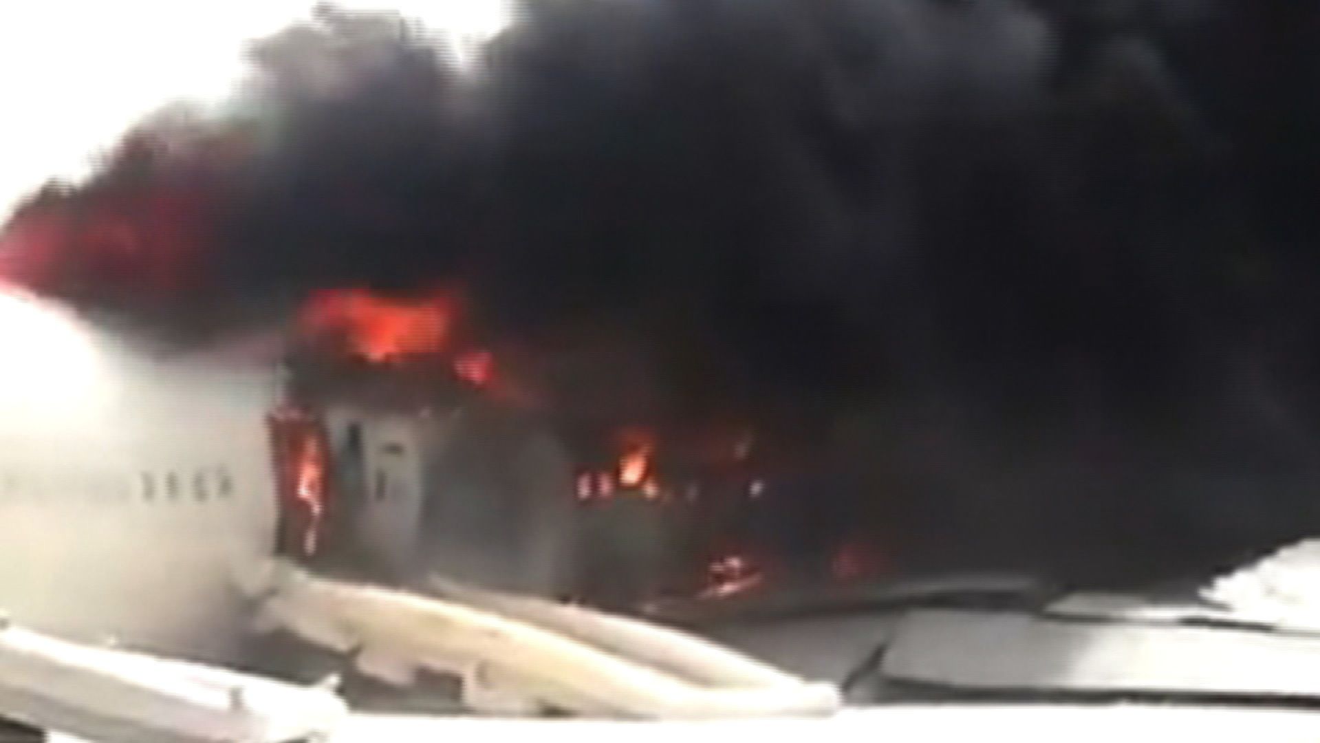 Flames engulfed the plane after all 300 people on board escaped.