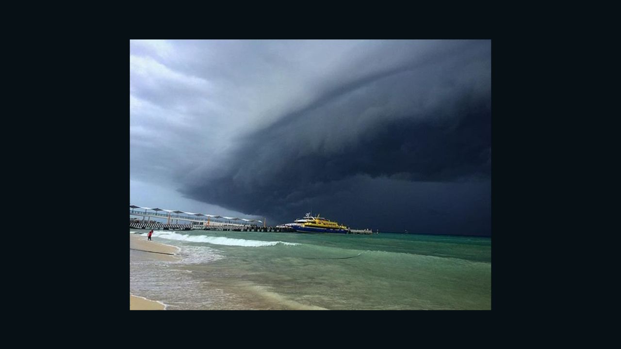 A perfect beach day was halted as ominous dark clouds from Hurricane Earl have made their way to Playa del Carmen, Mexico. 