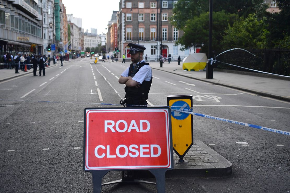 A police officer guards the scene of the knife attack Thursday at Russell Square in London.