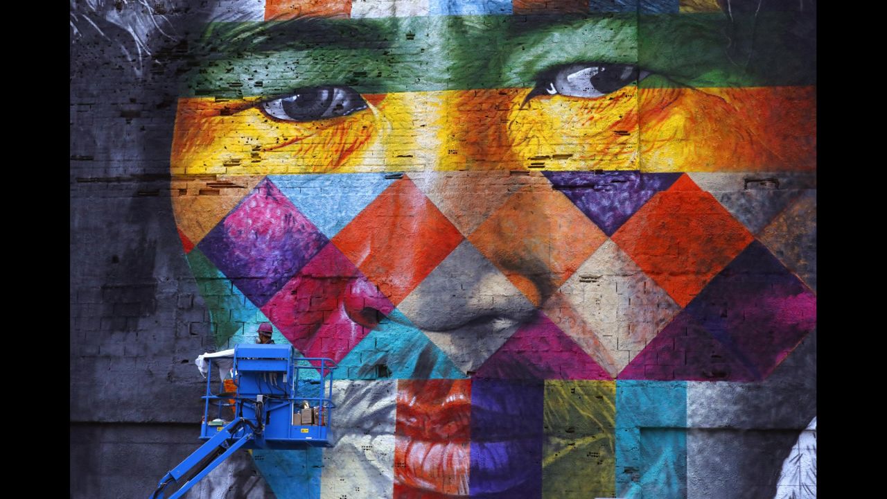 A giant mural created by Brazilian artist Eduardo Kobra is on display in Rio on Friday, July 22.