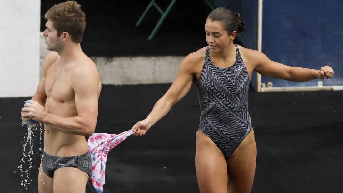 U.S. diver Kassidy Cook swats teammate Michael Hixon with a wet towel during a training session in Rio on August 3.