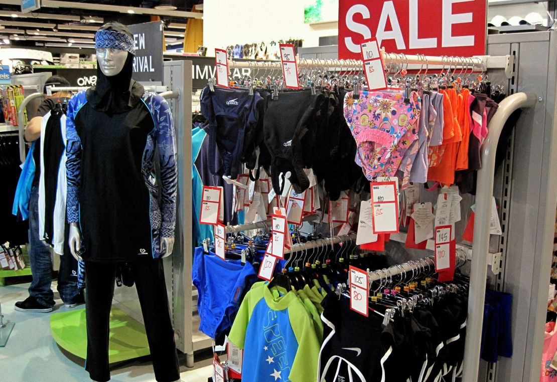 The burkini is an Islamic full-length swimming suit, seen on display (left) in a Dubai department store.