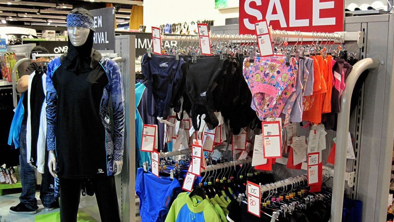 The burkini is an Islamic full-length swimming suit, seen on display (left) in a Dubai department store.
