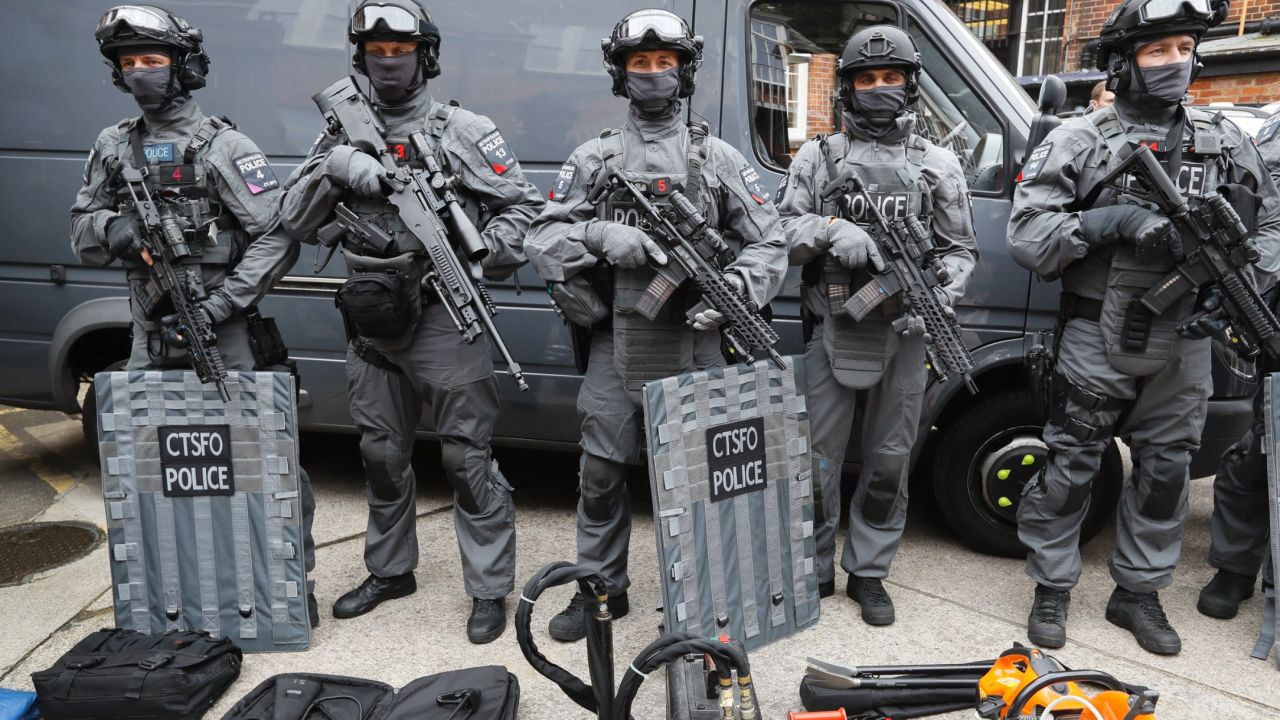 Police counter terrorism officers pose during a media opportunity in London, Wednesday, Aug. 3, 2016. London's police force is putting more armed officers on the streets 'to protect against the threat of terrorism.'' The increase in the number of officers follows attacks in France, Belgium and Germany. (AP Photo/Kirsty Wigglesworth)
