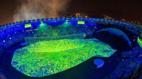 The colorful performances that opened the ceremony included lasers, 3-D projections and a cascade of water enveloping the stage.