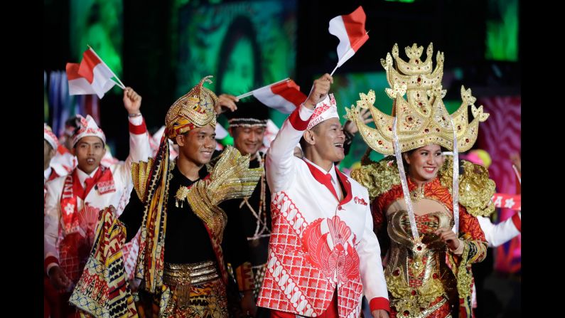 Members of Indonesia's Olympic team walk during the parade of nations.